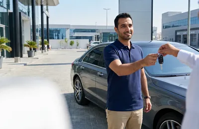 Comfort Drive driver delivering a client's car to a Dubai service centre